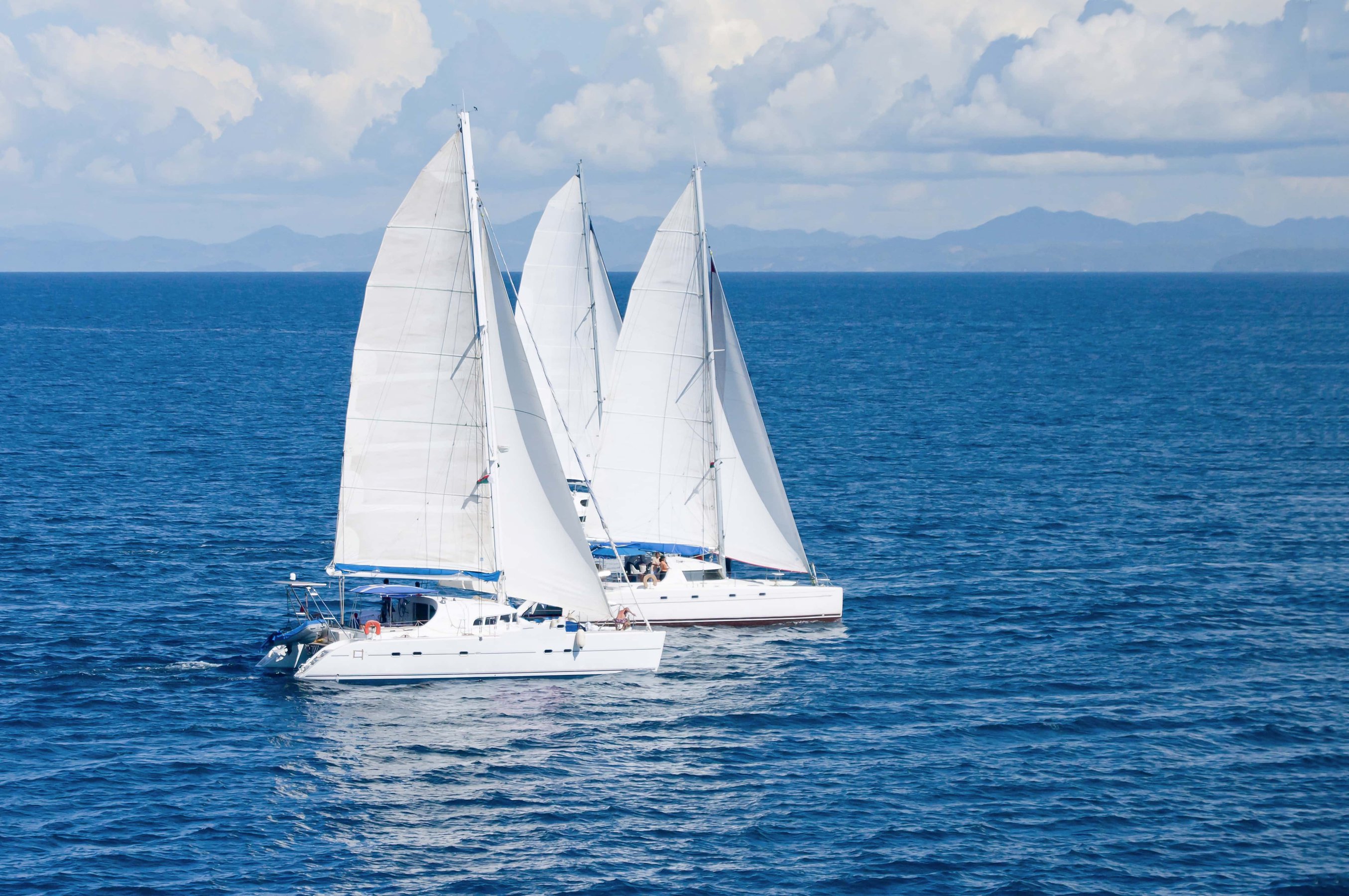 Three Sailboats Racing In The Indian Ocean