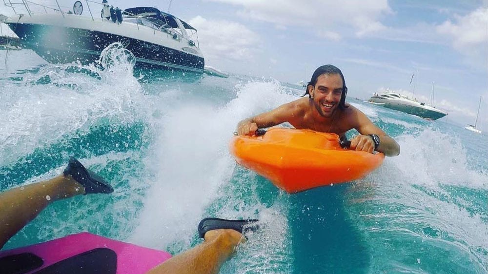 Rider piloting a jet body board prone-position
