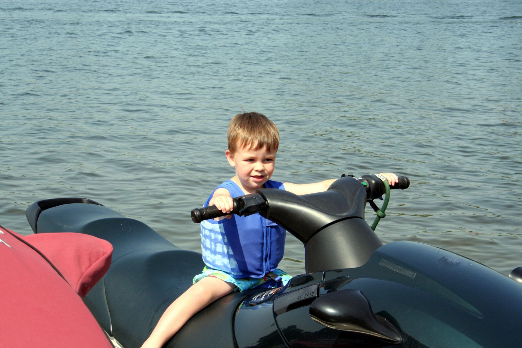 Jet skis and kids with jacket