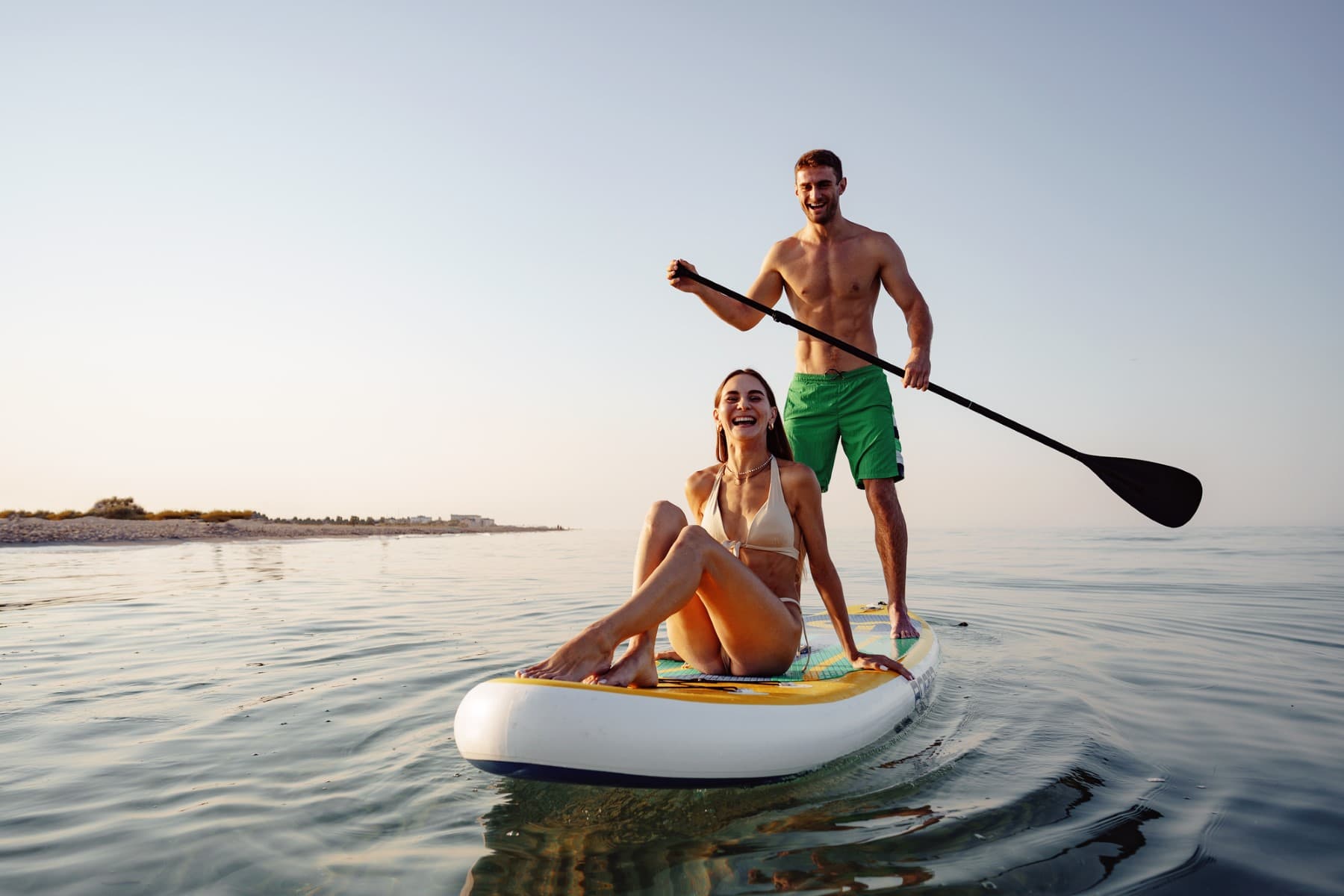 Renting Paddle Board Couple Having Fun